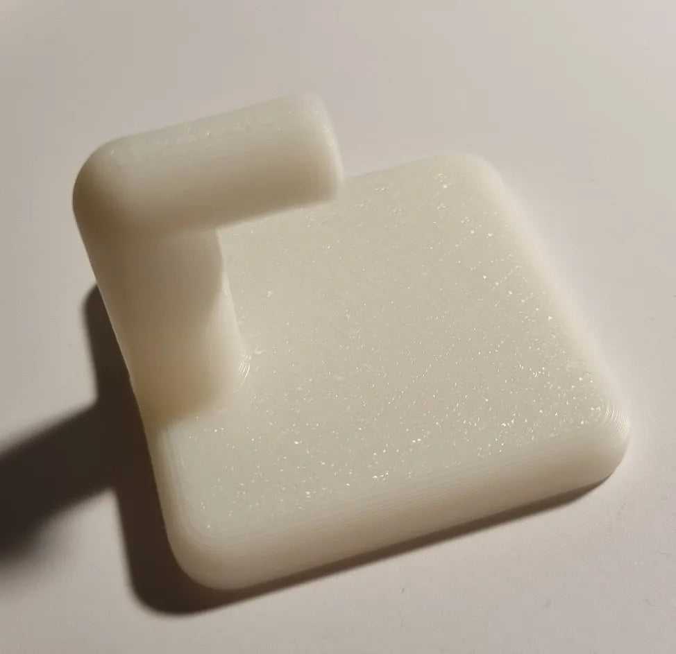 Wall hook holding a towel