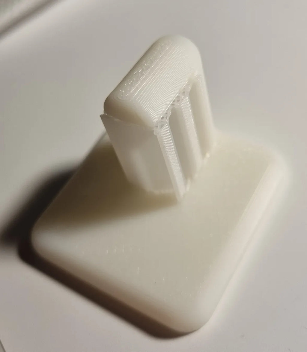 Adhesive wall hook