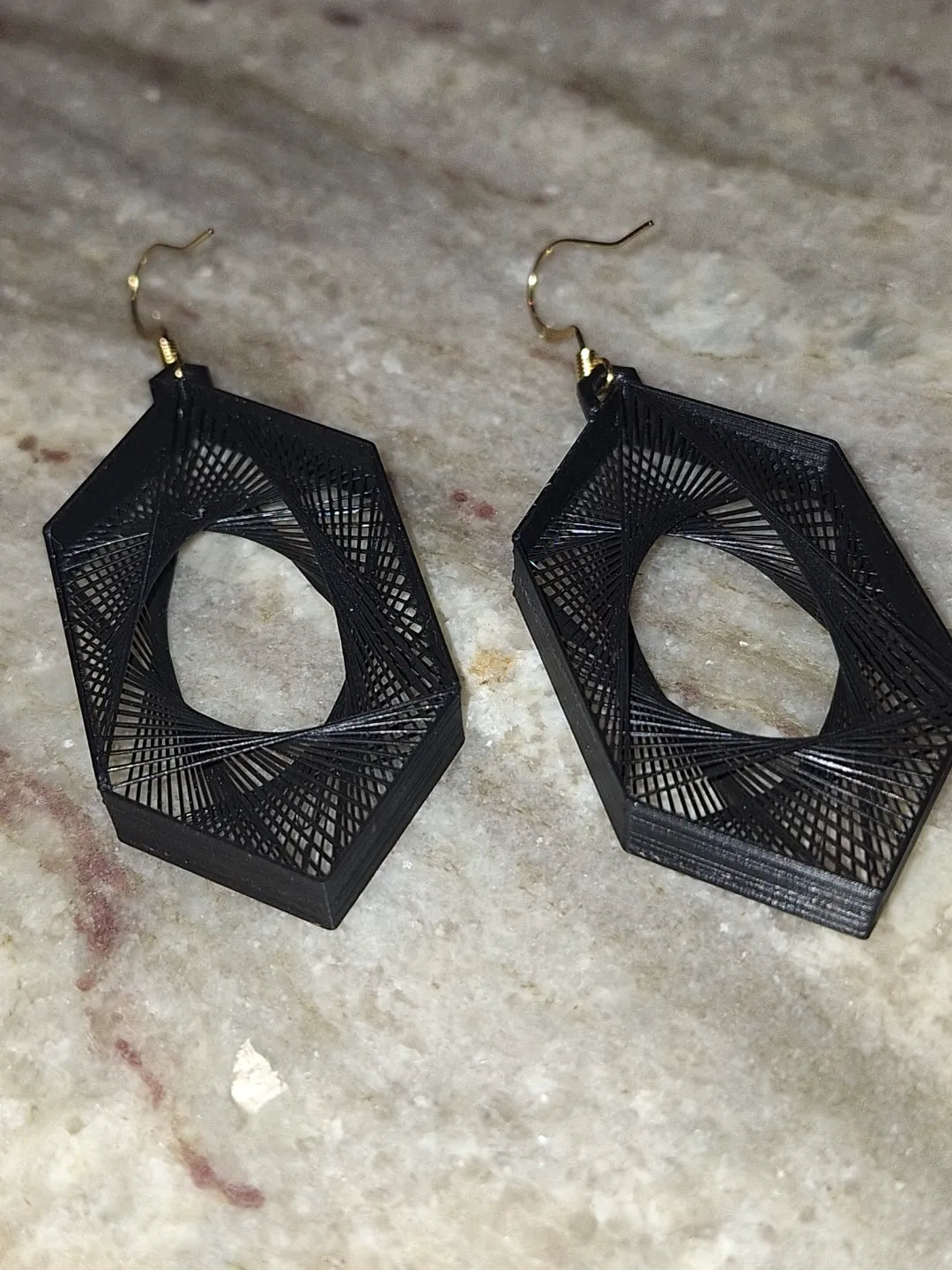 Hexagon earrings worn