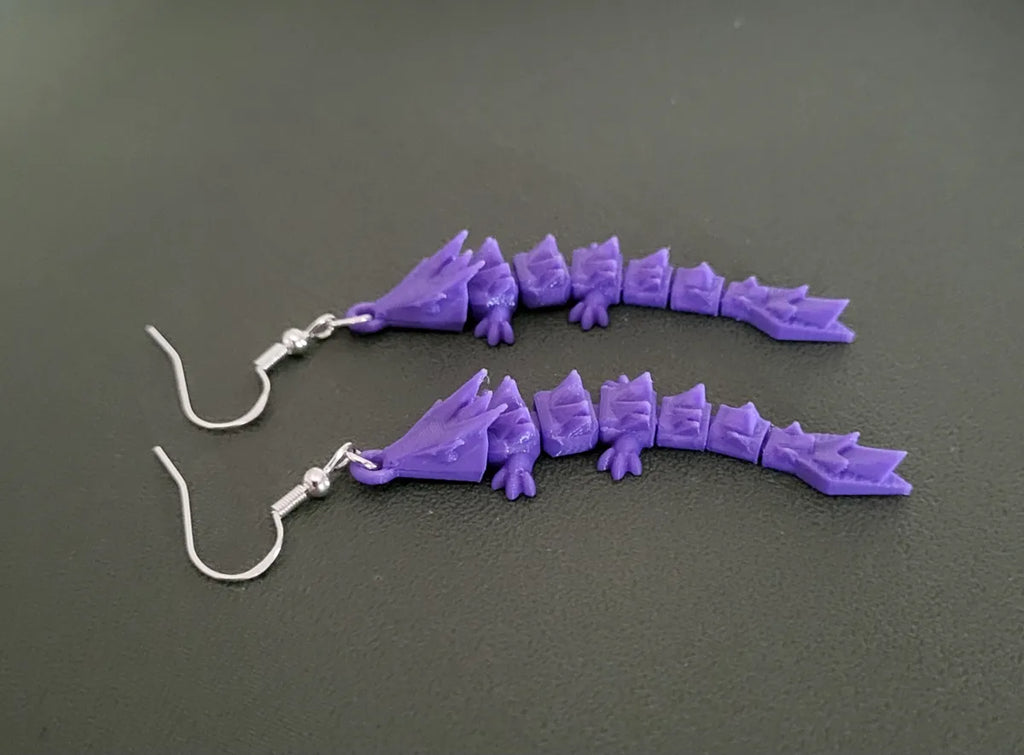 Dragon earrings worn
