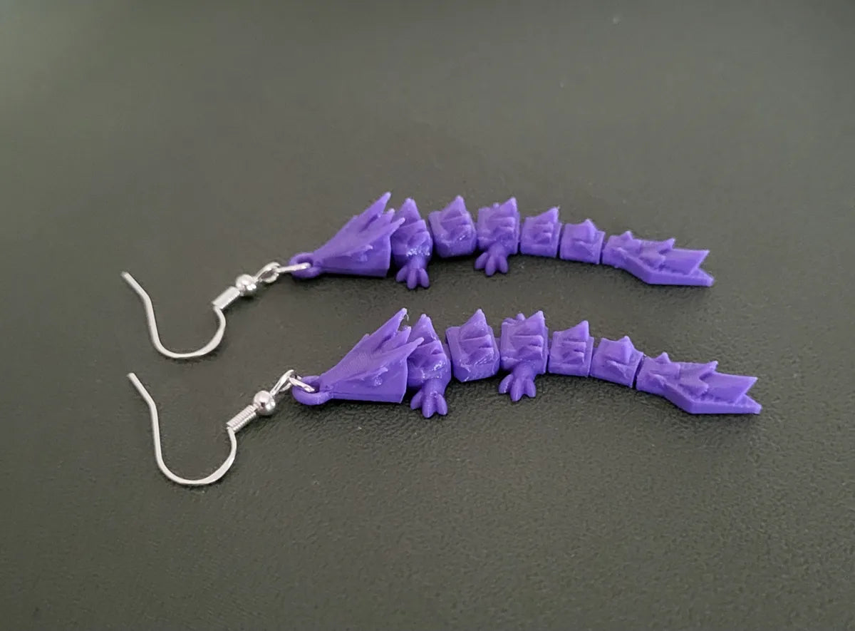 Dragon earrings worn