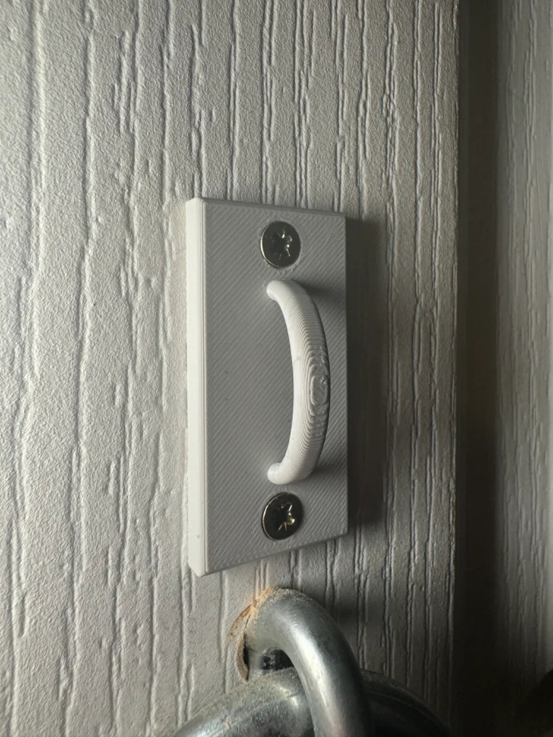 Leash hook mounted on wall