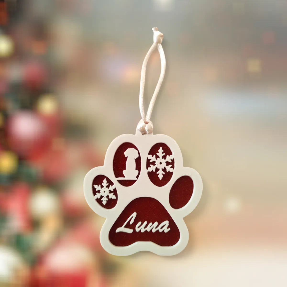 Dog paw ornament on a Christmas tree