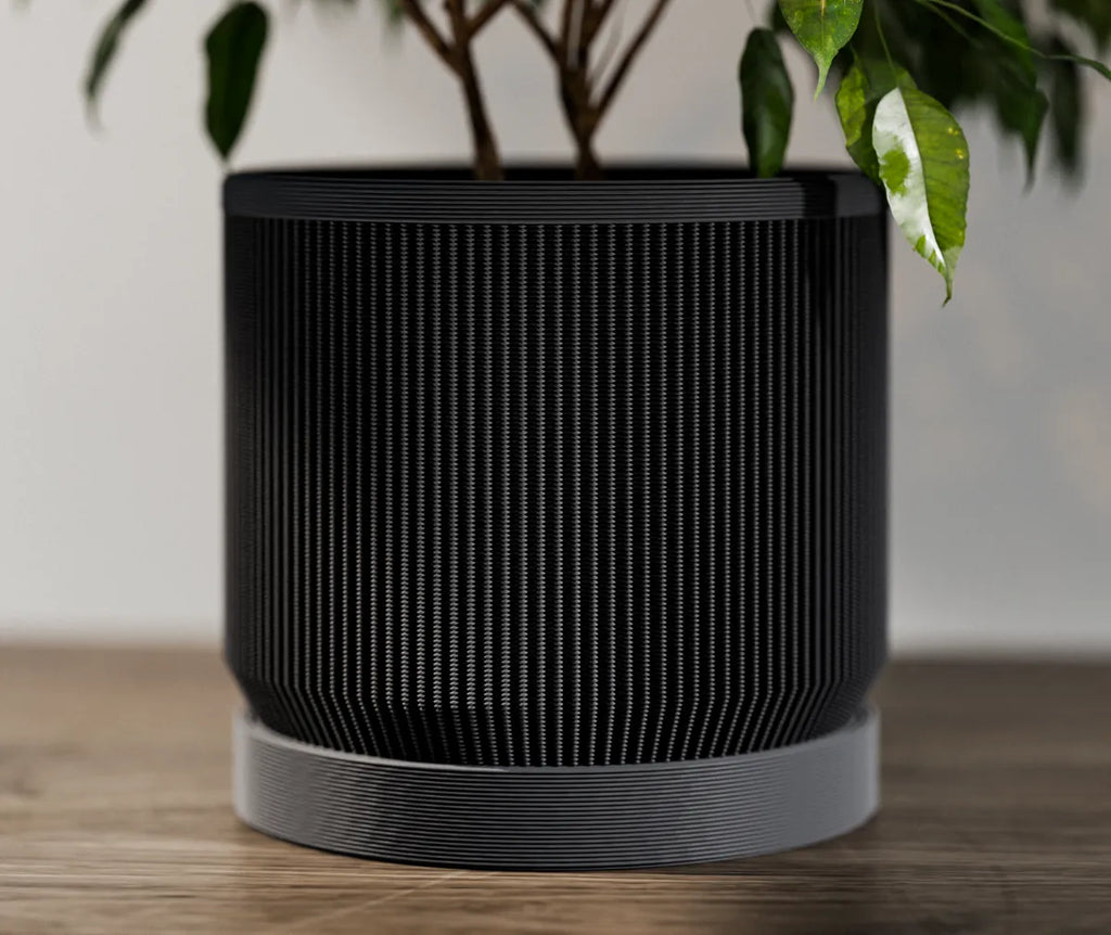 Ribbed planter with plant