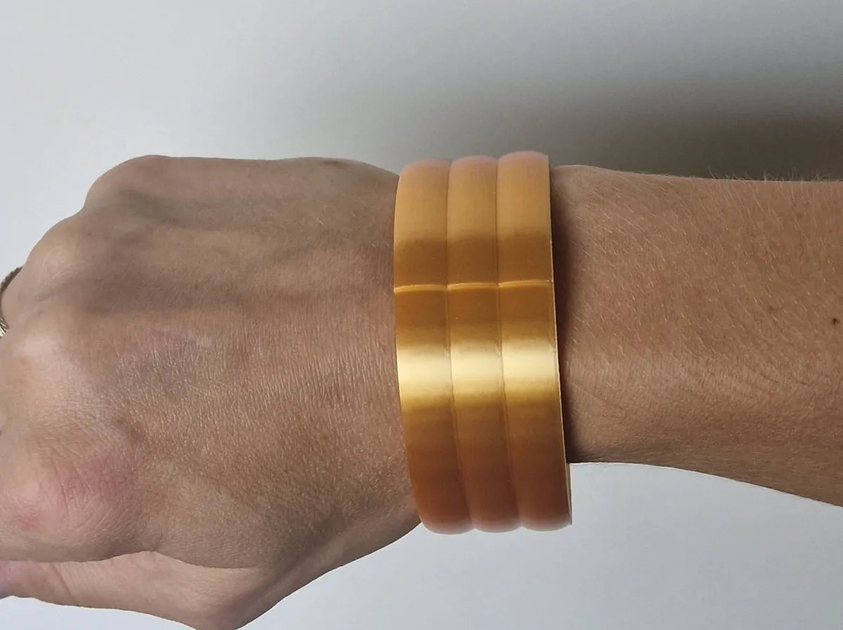 Stacking bangles worn