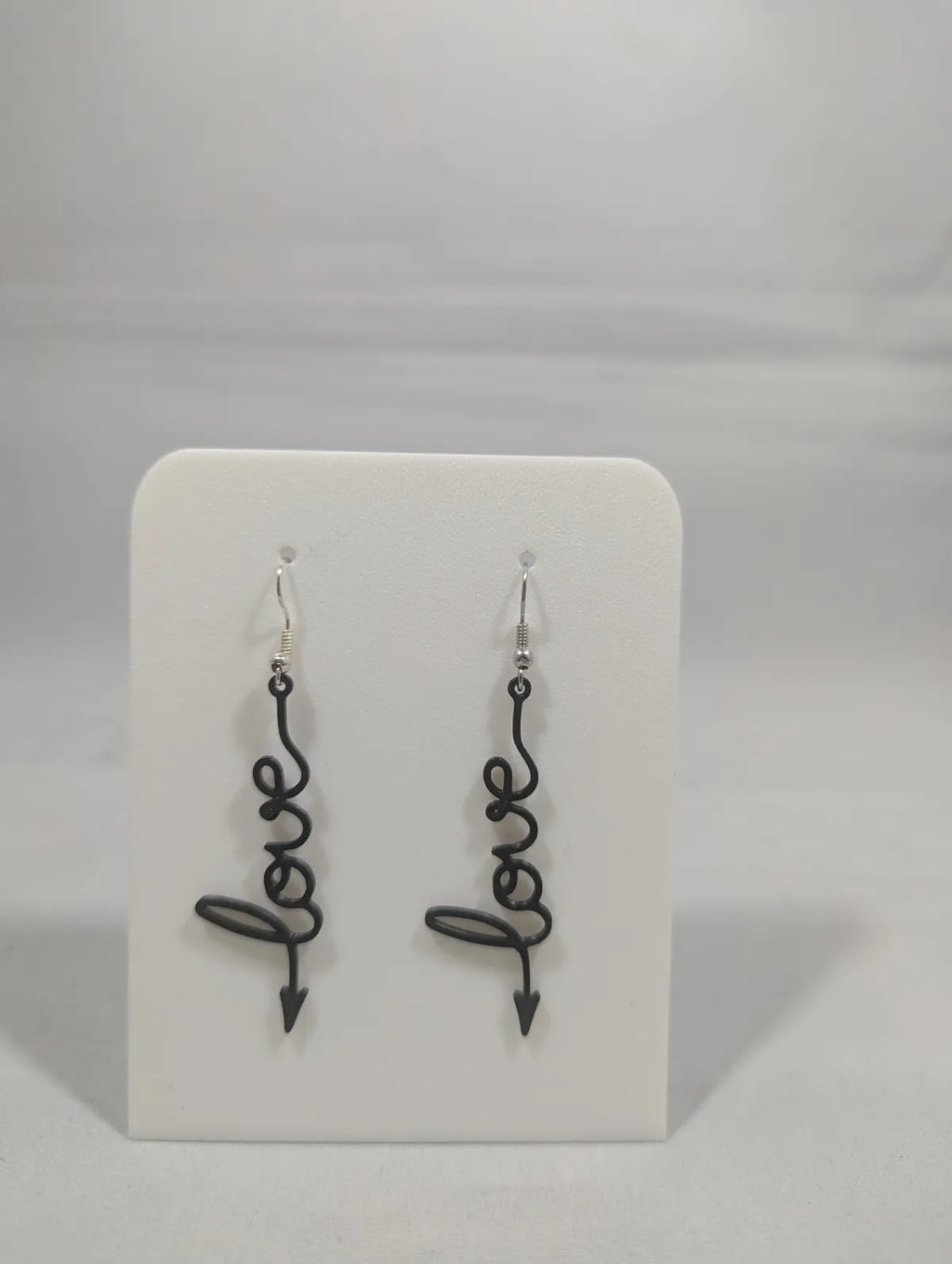 LOVE arrow earrings worn